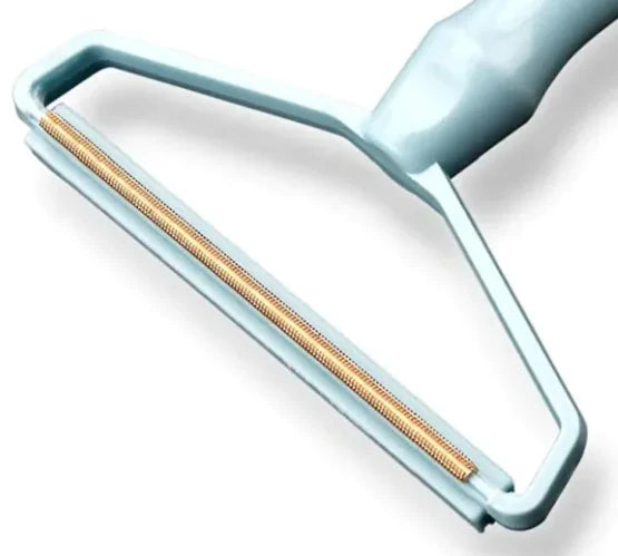 Close-up of the blue rake and its small metal teeth